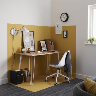 office room with table and wall clock