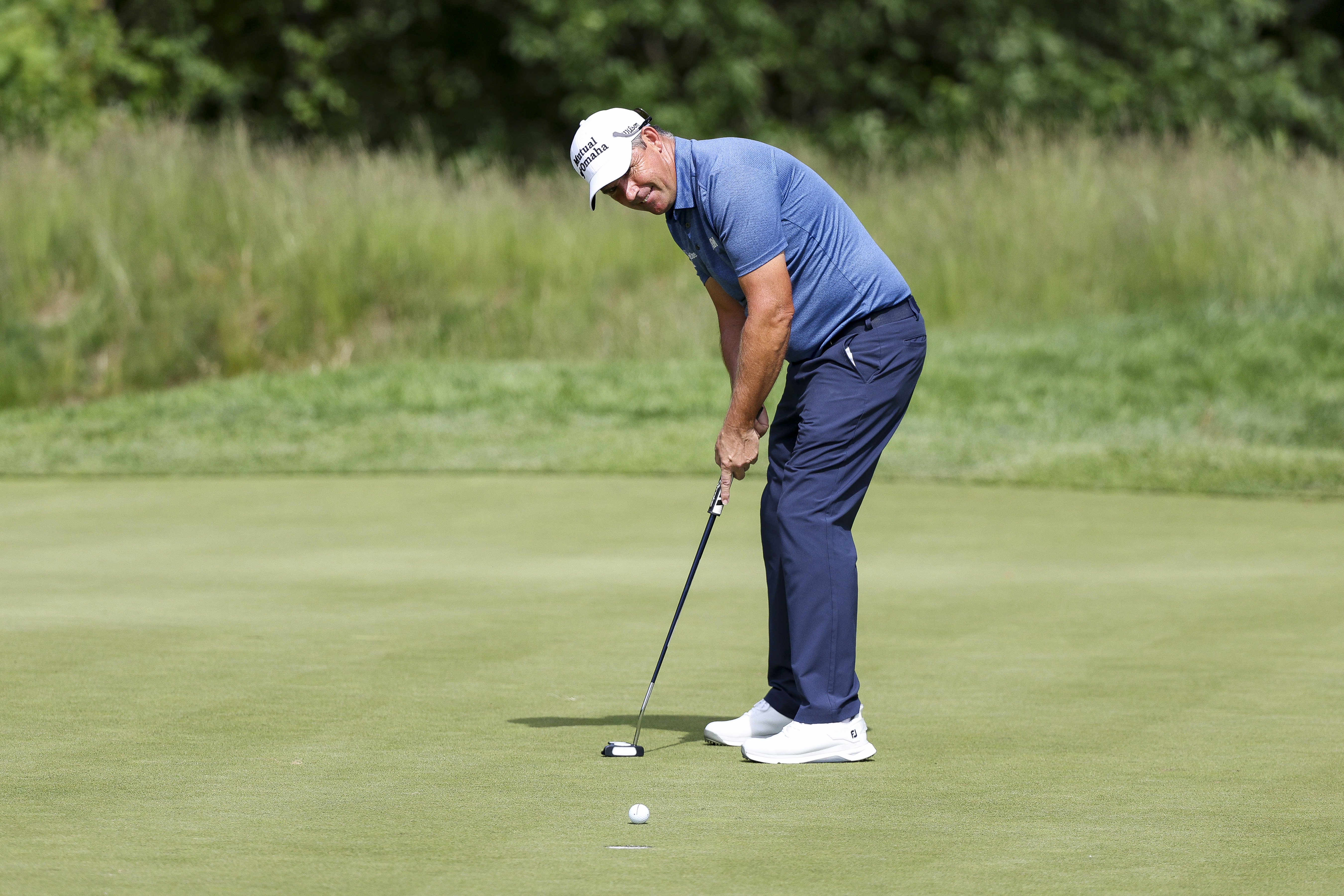Padraig Harrington hits a putt