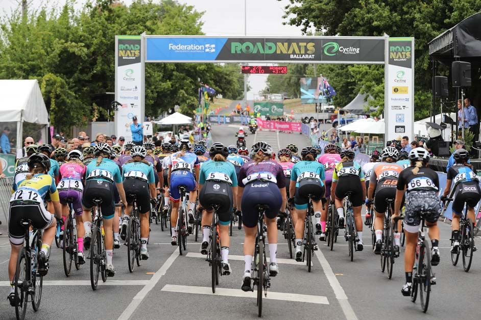 The riders complete lap two