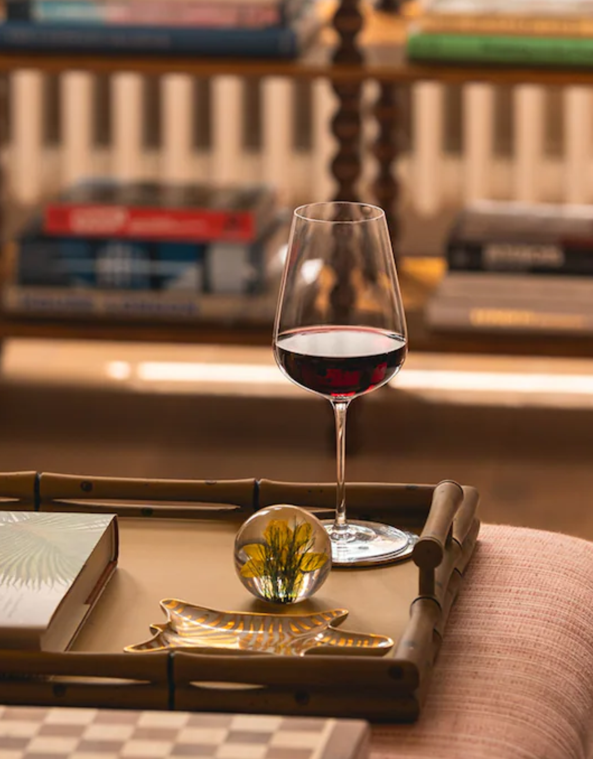 A Richard Brendon x Jancis Robinson wine glass styled on a bamboo tray