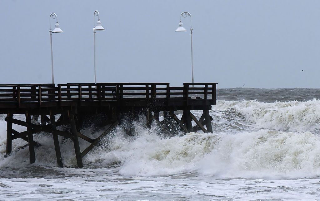 Waves batter the Florida coastline as Tropical Storm Nicole strengthens.