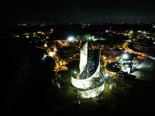 Tri Hita Karana tower seen in light with its twisting volume swirling upwards in bali