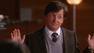 Michael J. Fox standing with his hands up on The Good Wife.