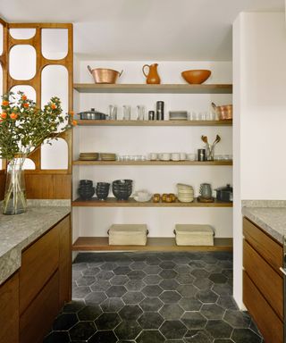 kitchen with open shelves and cut out screen