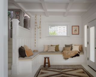 an entryway with built-in seating