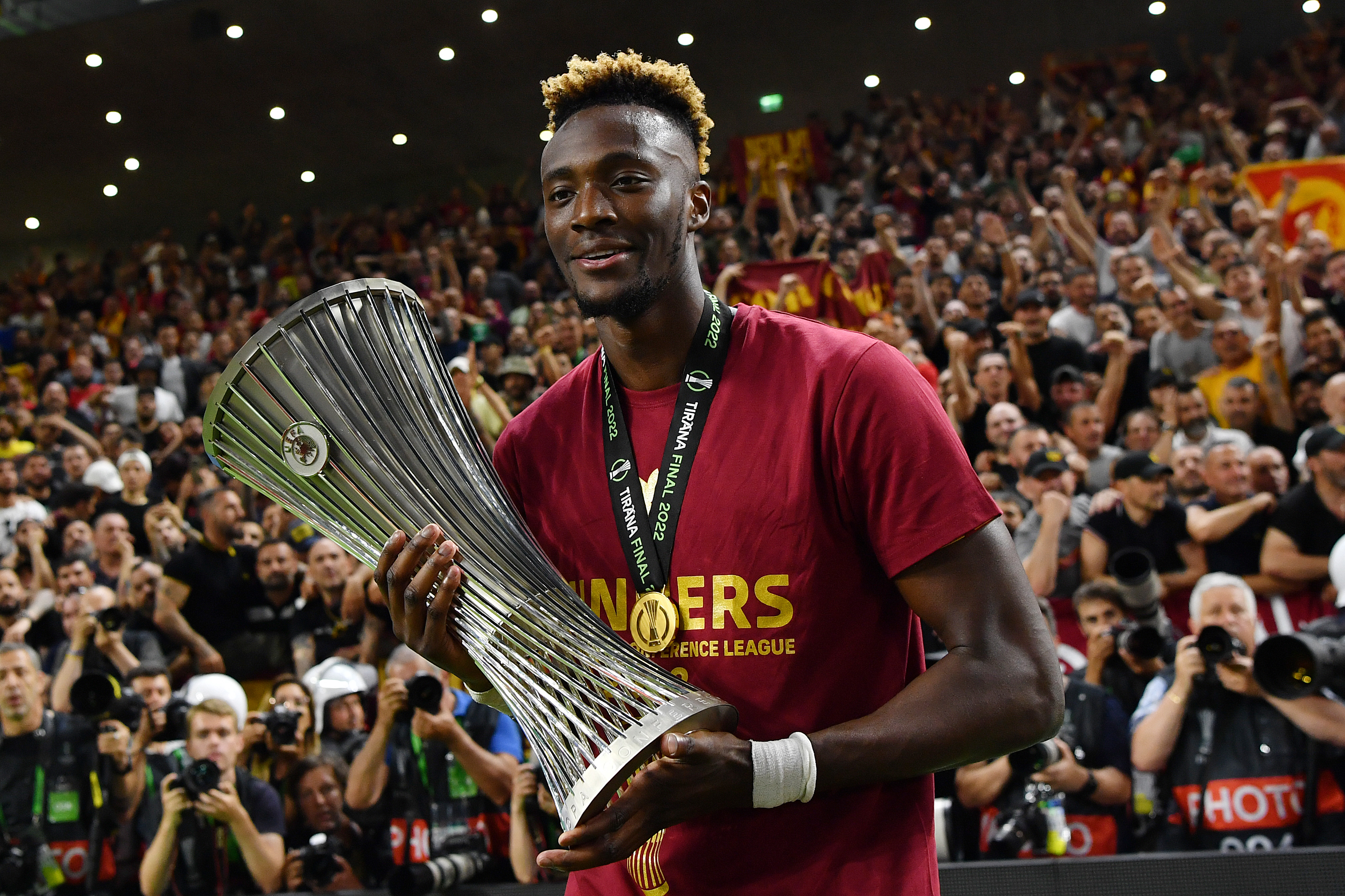 Tammy Abraham celebrates with the UEFA Europa Conference League trophy after Roma's win over Feyenoord in the final in May 2022.
