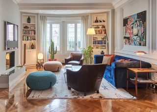 A small living room with pouffes