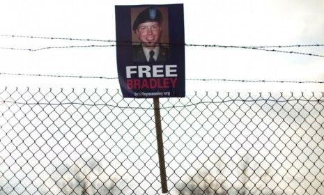 A &amp;quot;Free Bradley Manning&amp;quot; sign hangs from barbed wire in Fort Meade, Maryland: The accused WikiLeaks informant has been nominated for the Nobel Peace Prize.