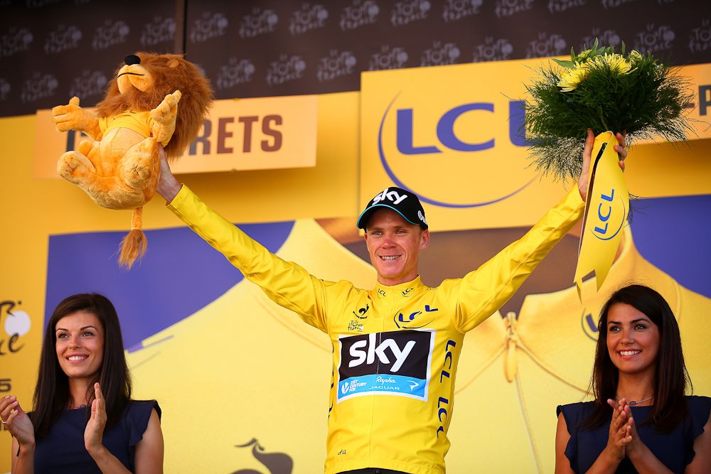 Chris Froome in yellow on the stage 11 podium.