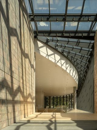 Inside new Joslyn Art Museum building, with glazing and underside of curved concrete staircase