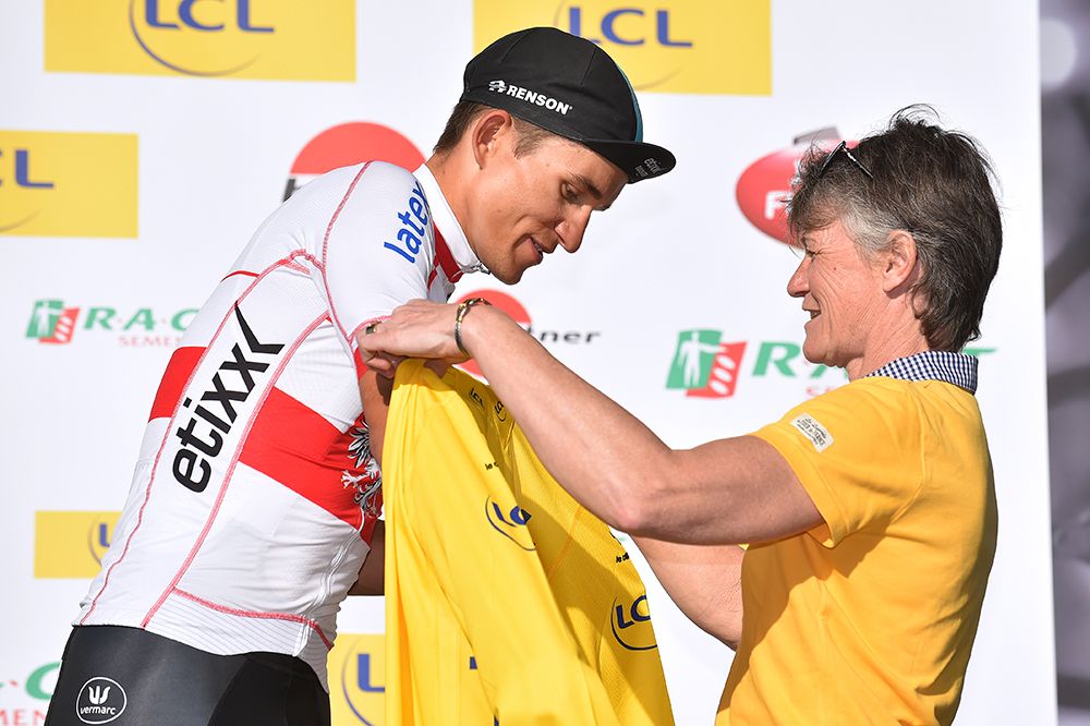 Michal Kwiatkowski pulls on the yellow jersey