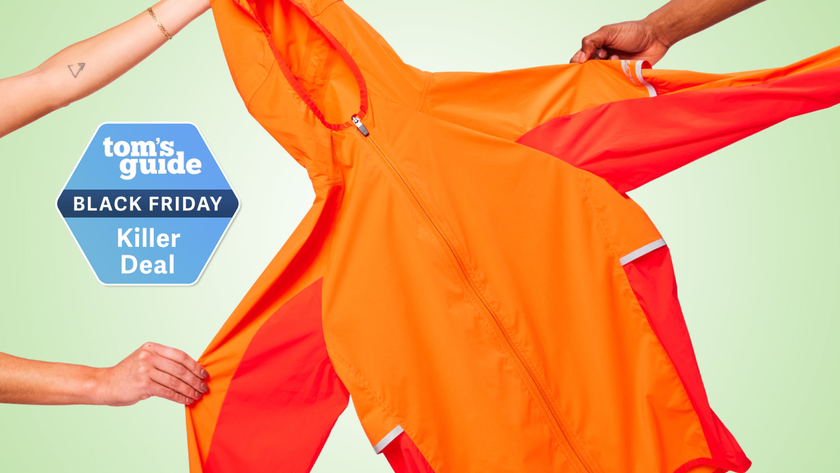 the Altra Trail Wind Jacket being held up by three hands and placed next to a Tom&#039;s Guide Black Friday Killer Deal label