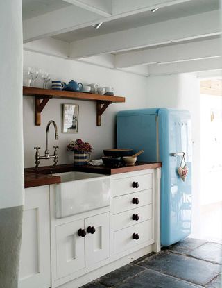 Kitchen with blue fridge in coastal home