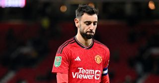 Manchester United captain Bruno Fernandes looks dejected following the team's defeat during the Carabao Cup Fourth Round match between Manchester United and Newcastle United at Old Trafford on November 01, 2023 in Manchester, England.