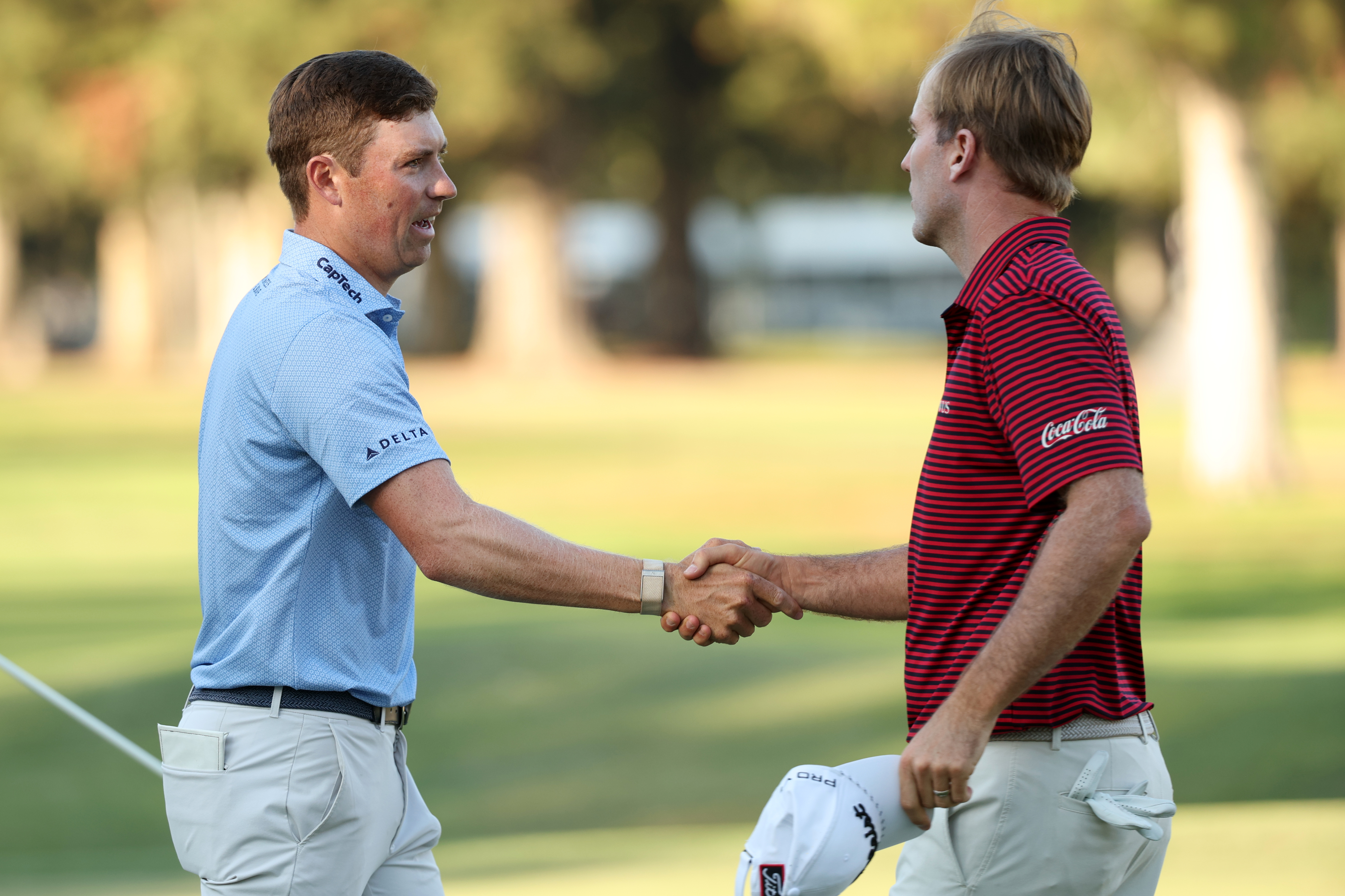 Ben Griffin and Russell Henley shake hands