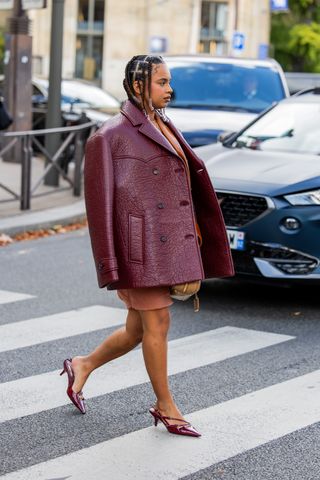 Fashion influencer wearing a burgundy blazer