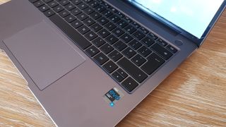 A side view of the Huawei MateBook 14s showing the keyboard and power button