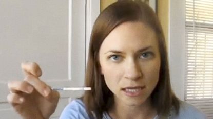 woman with pregnancy test