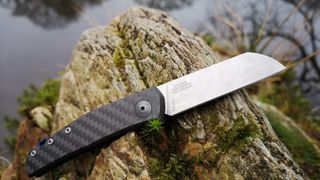 Zero Tolerance 0230 Jens Anso camping knife on rock outdoors