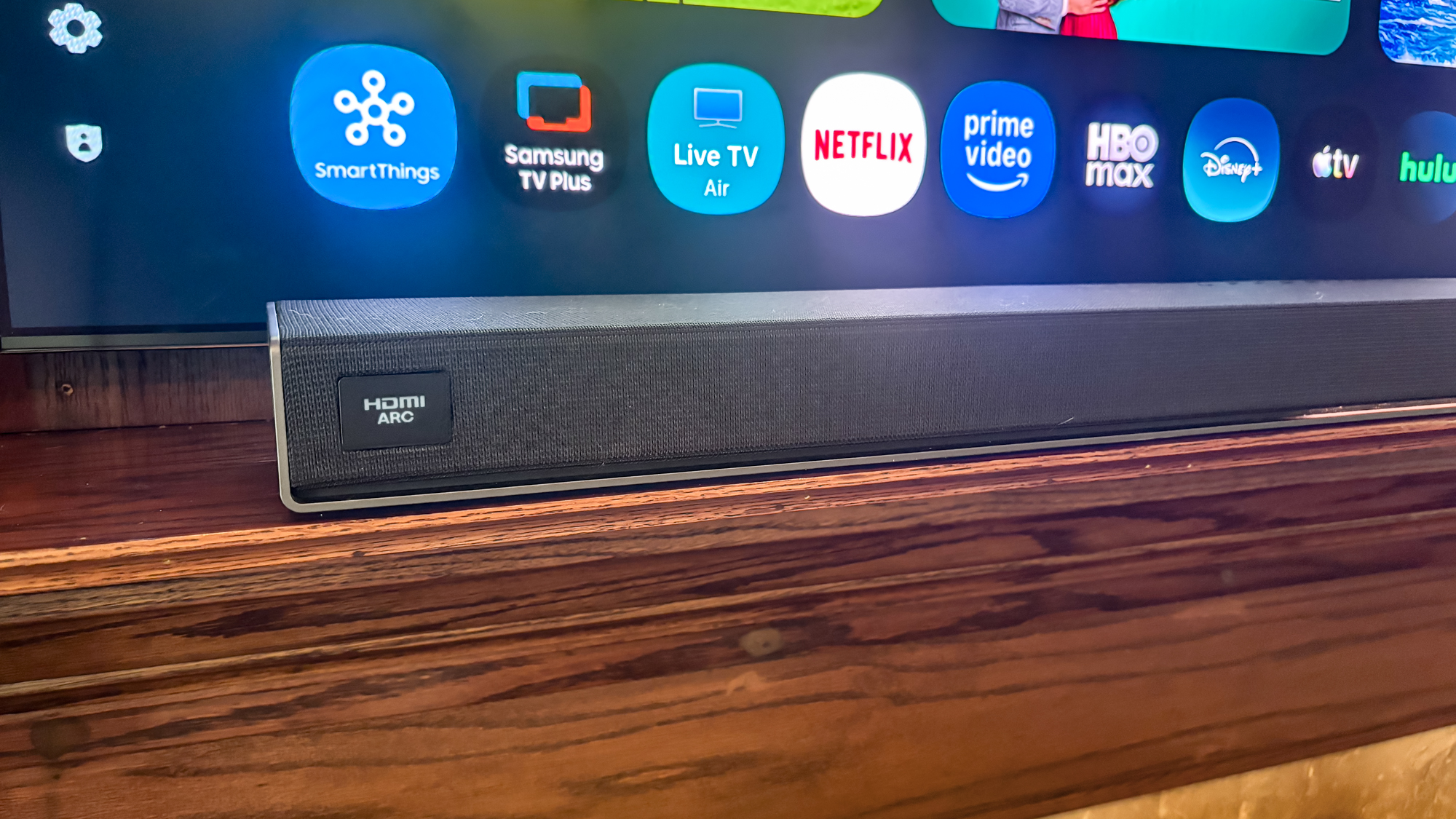 LG Sound Suite H7 Soundbar on a TV stand