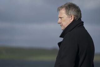 DI Jimmy Perez (Douglas Henshall) stands out in the open, deep in thought, the landscape behind him slightly out of focus