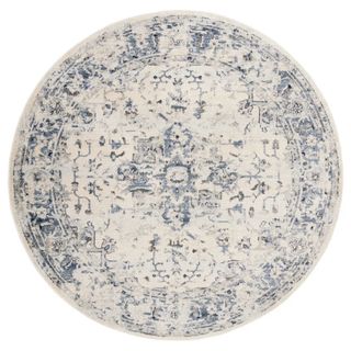 A white and blue circular patterned rug