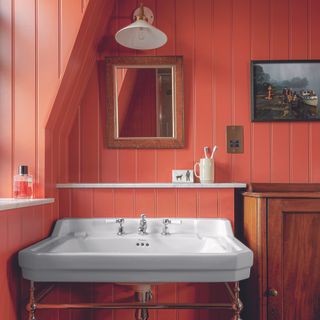 Orange bathroom with wall panelling