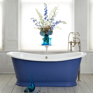 bathroom with wooden flooring and blue with white bathtub