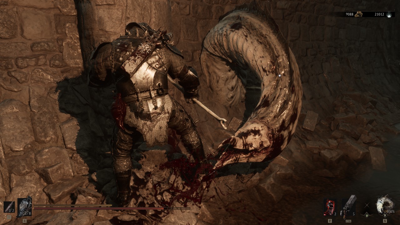 Killing an eel-like creature in Mortal Shell 2