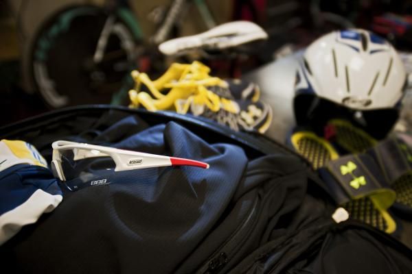 A Vacansoleil rider's kit lies on the ground