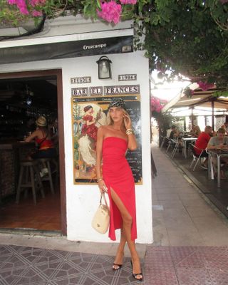 Emili Sindlev wearing a red dress in Spain