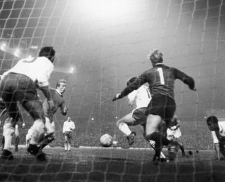 Denis Law scores for Manchester United against Anderlecht in November 1968.