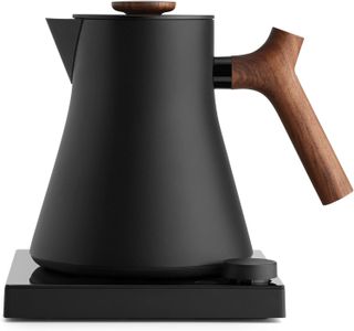 Fellow Corvo EKG kettle in black with a wooden handle, on a white background