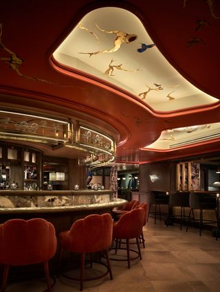 opulent curved bar with ceiling display in Madrid