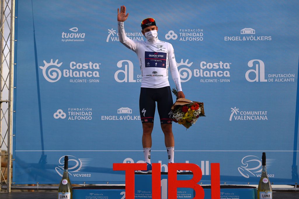 ALTO DE LAS ANTENAS DEL MAIGMO TIBI ALICANTE SPAIN FEBRUARY 04 Remco Evenepoel of Belgium and Team QuickStep Alpha Vinyl White Best Young Rider Jersey celebrates at podium after the 73rd Volta A La Comunitat Valenciana 2022 Stage 3 a 1551km stage from Alicante to Alto De Las Antenas Del Maigmo Tibi 1080m VCV2022 on February 04 2022 in Alicante Spain Photo by Dario BelingheriGetty Images