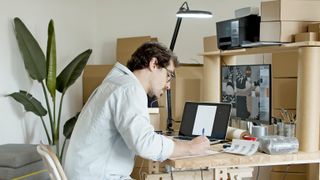 A person working at a laptop.