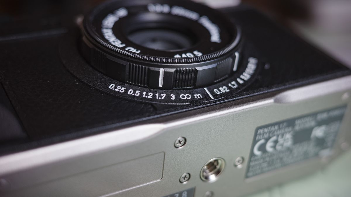 Close up of the Pentax 17 compact film camera's focus distance scale