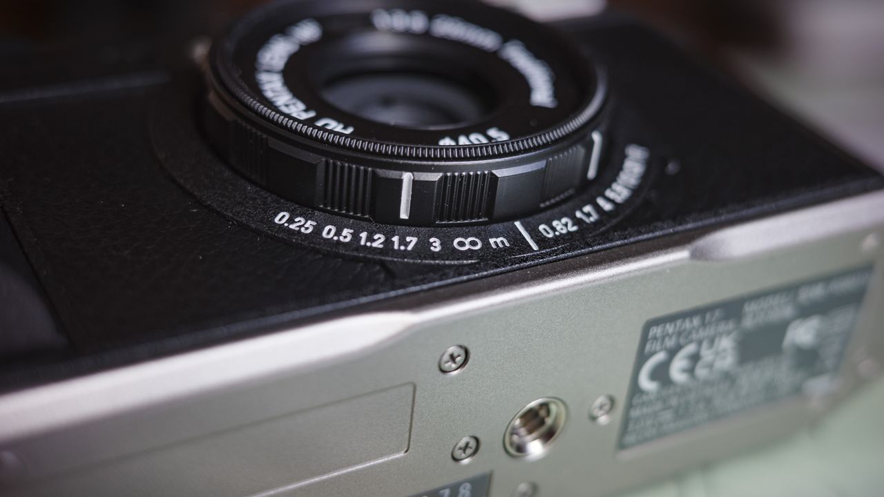 Close up of the Pentax 17 compact film camera's focus distance scale