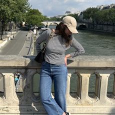 Girl wearing striped shirt in Paris