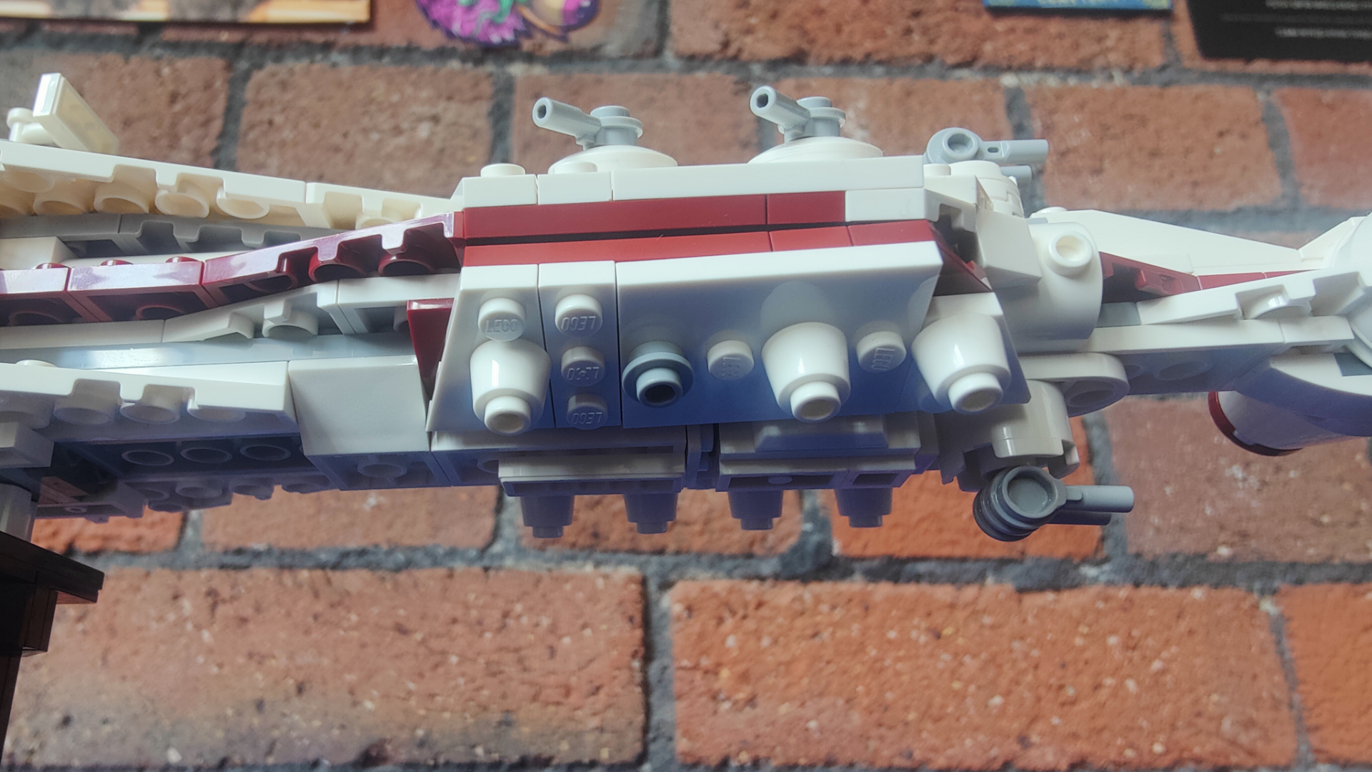 The underside of the Lego Tantive IV, showing one missing escape pod