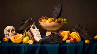 A selection of shoes and fruit on a table