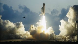 a space shuttle lifts off