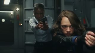 A shot of Shira Haas' Ruth and Xosha Roquemore's Leila holding handguns in Captain America: Brave New World