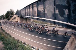 The peloton pass under a rail bridge en route to Avila Beach
