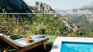 pool and balcony in Austria with mountains in background