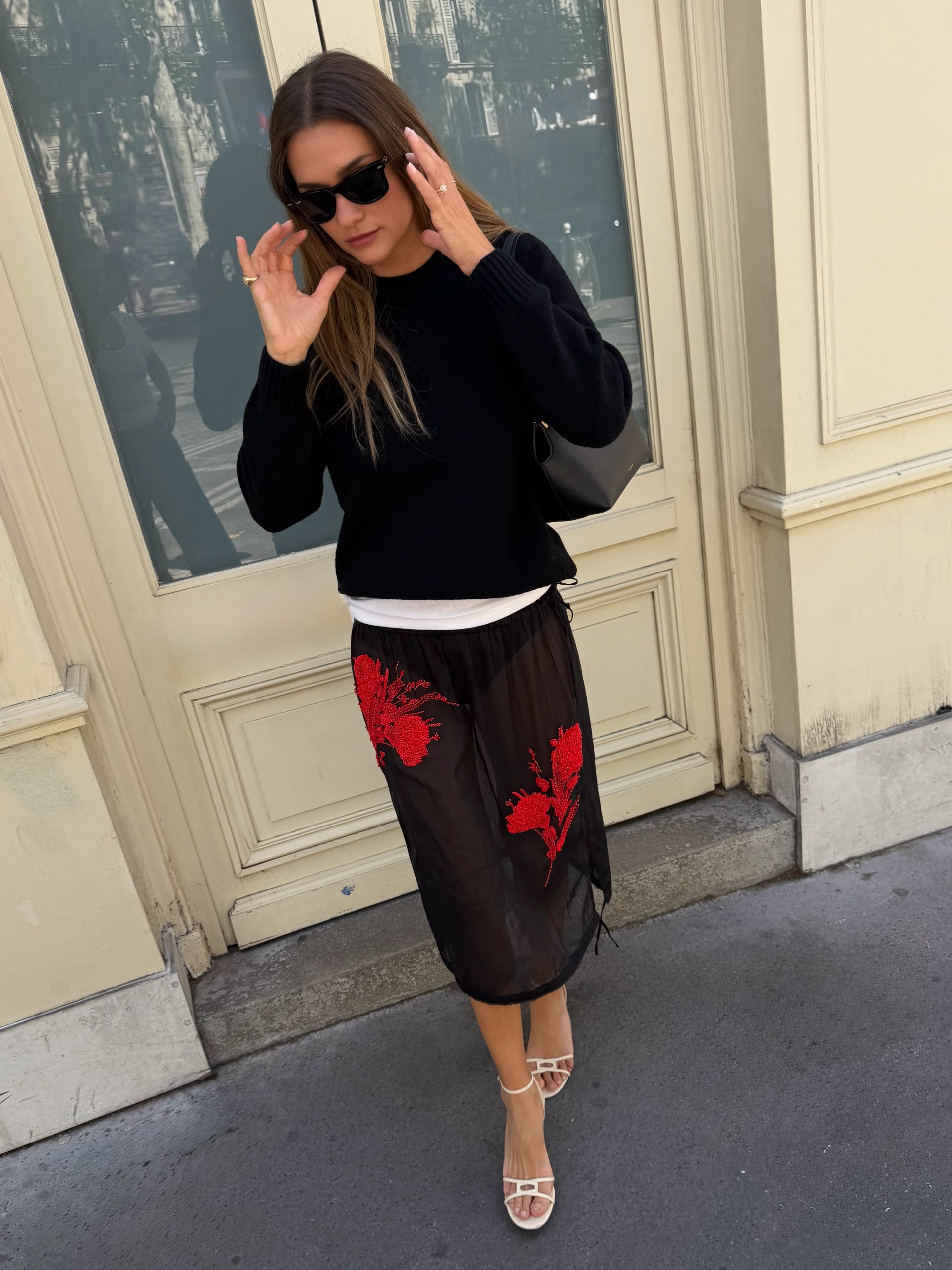 Anne-Laure Mais wearing a Prada midi skirt.