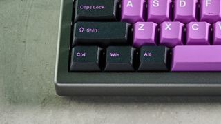 A black and purple Epomaker EK68 wireless mechanical keyboard