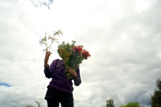 Harris’ wife's rare solo shot with bunch of wildflowers.