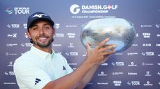 Marco Penge holds up the Danish Golf Championship trophy after his win in 2025