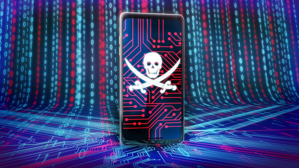 A skull and bones displayed on a smartphone screen against a background of circuits and bits.